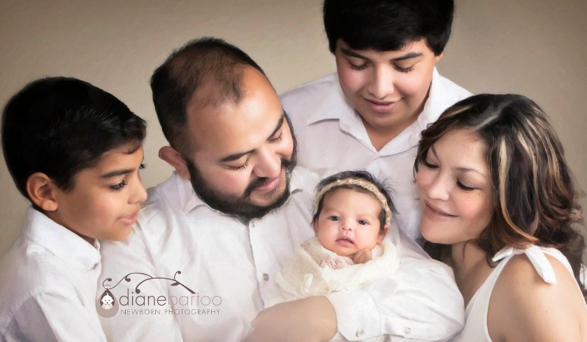 Riverside newborn girl with family