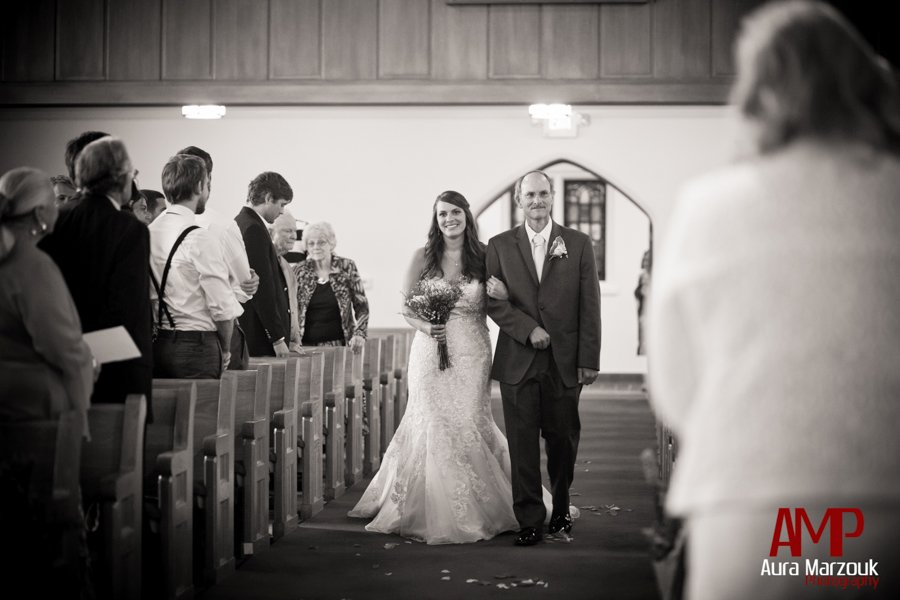 Bride is escorted down the aisle by father. Pink and Green Reynolda Presbyterian wedding photography by Aura Marzouk Photography