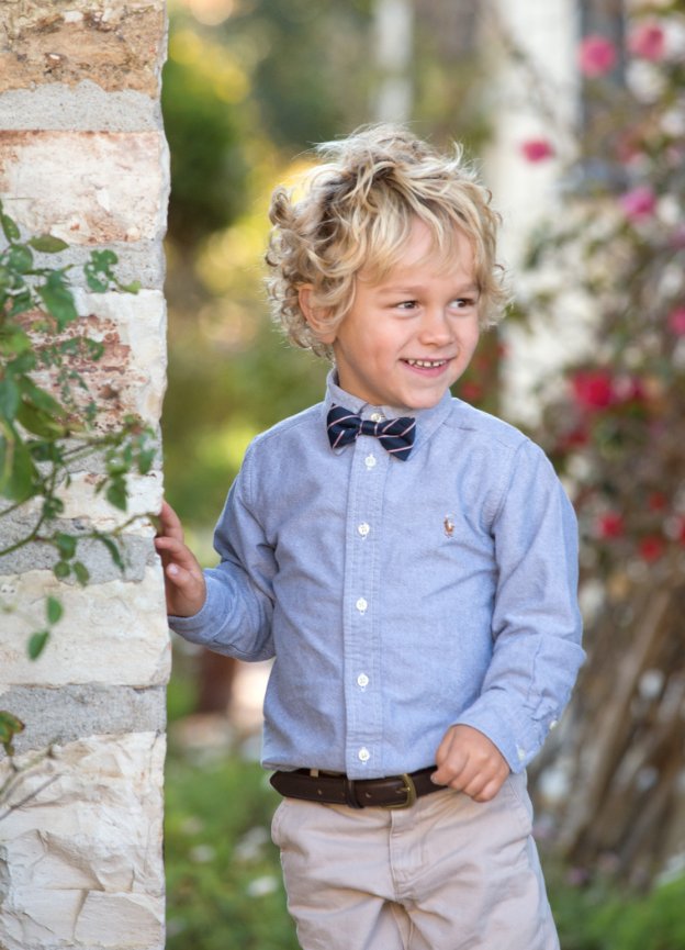 Portrait of messy haired bow-tied boy, Monterey
