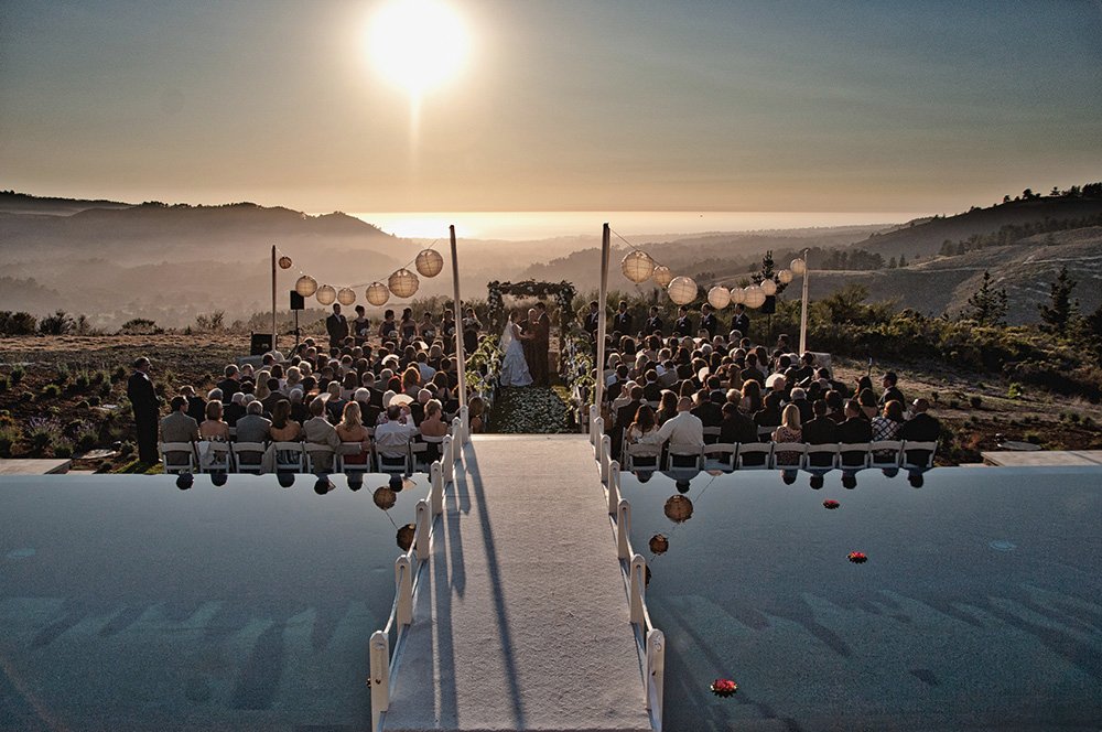 Bridal bridge view of wedding ceremony over Point Lobos