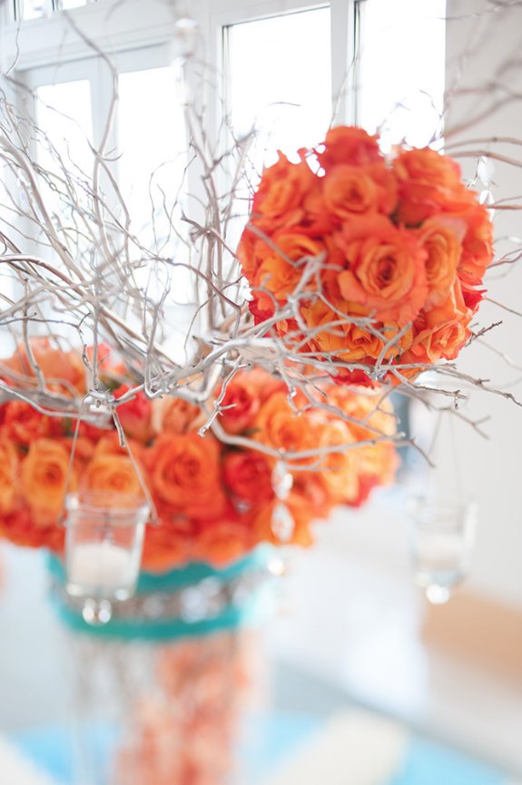 Orange roses for table decoration at Clement hotel reception