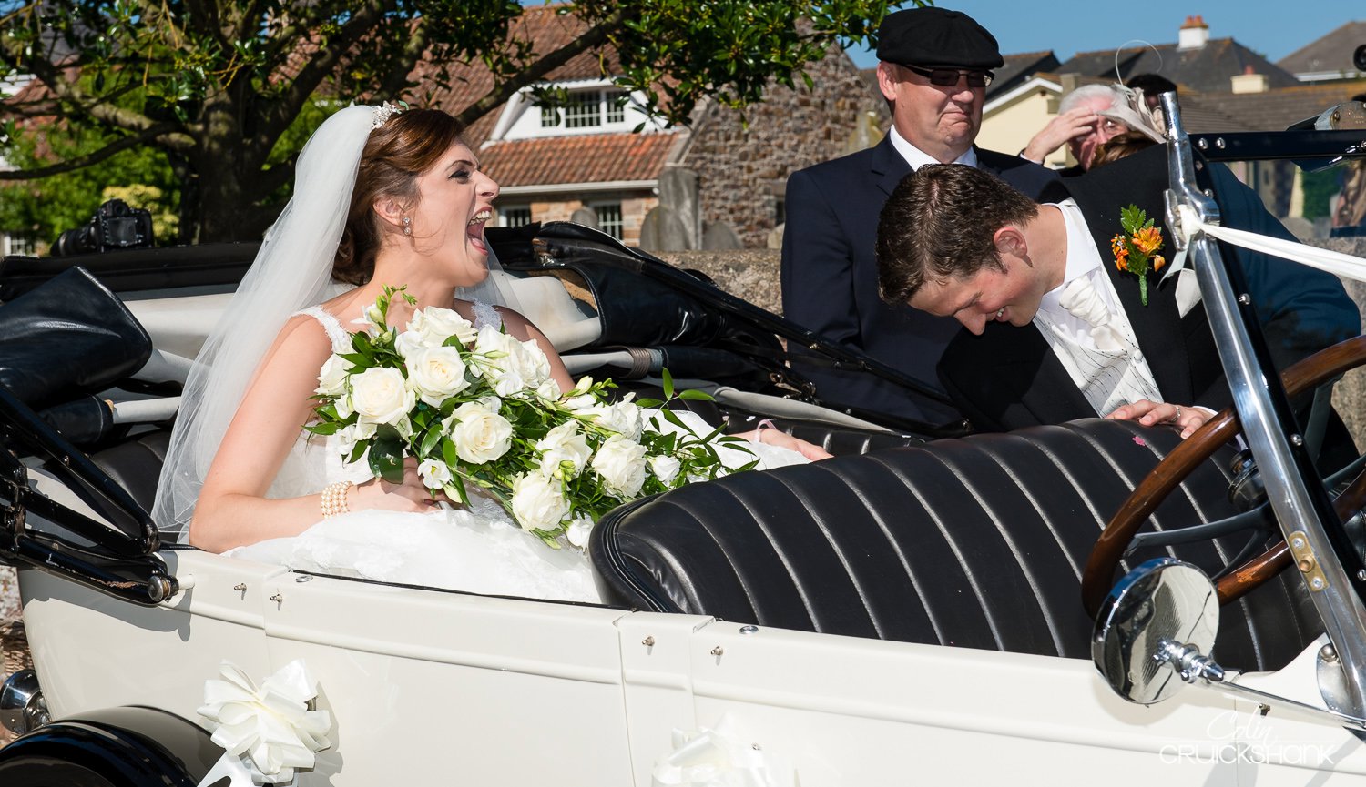 bride and groom in wedding car