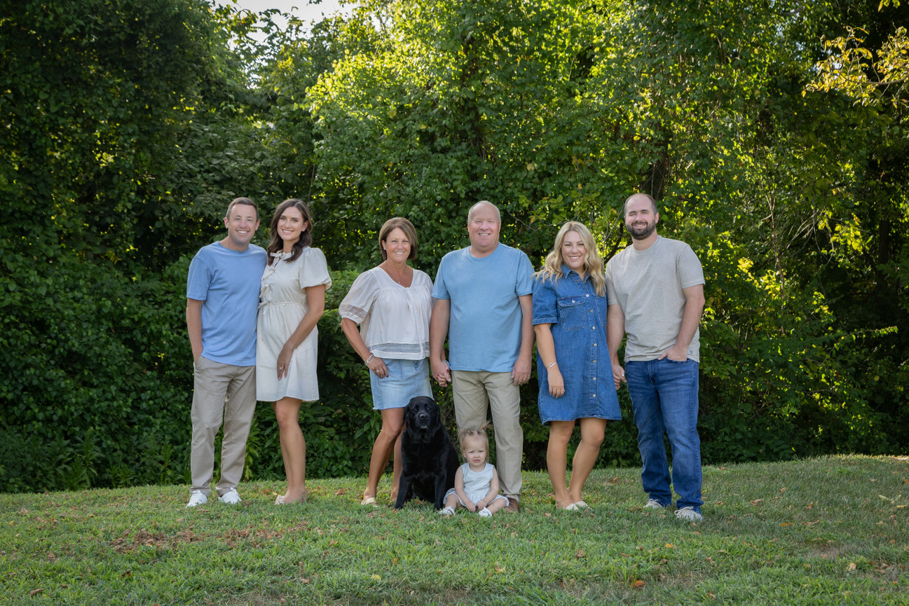 Family with dog in backyard