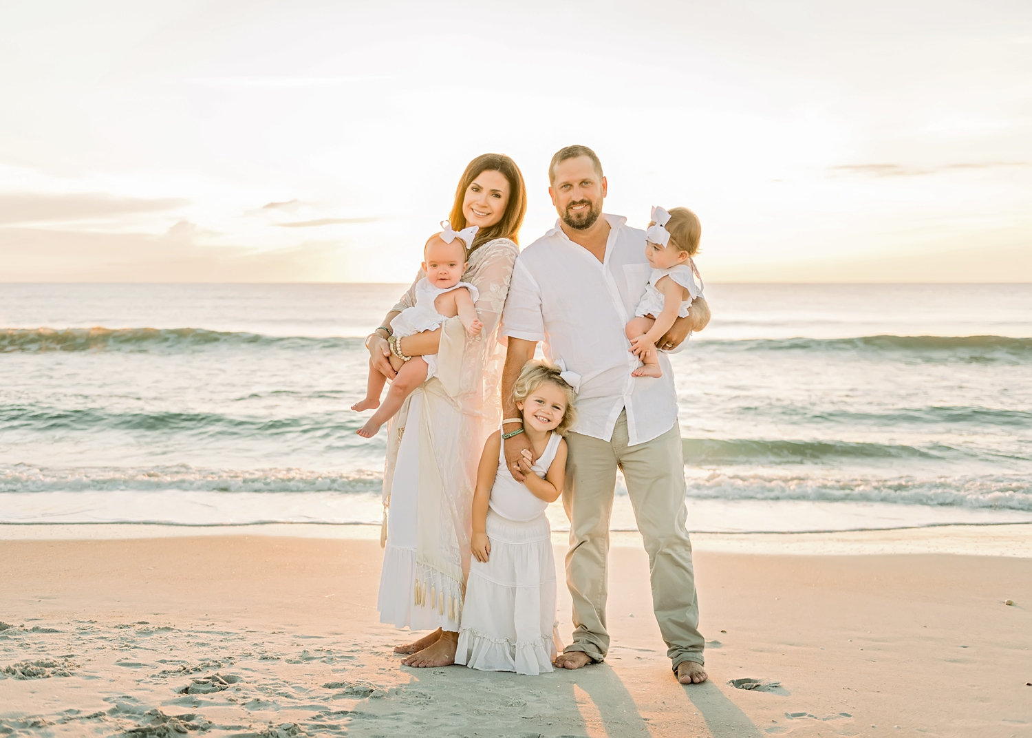 family of 5 looking at the camera, Ponte Vedra Beach sunrise photography