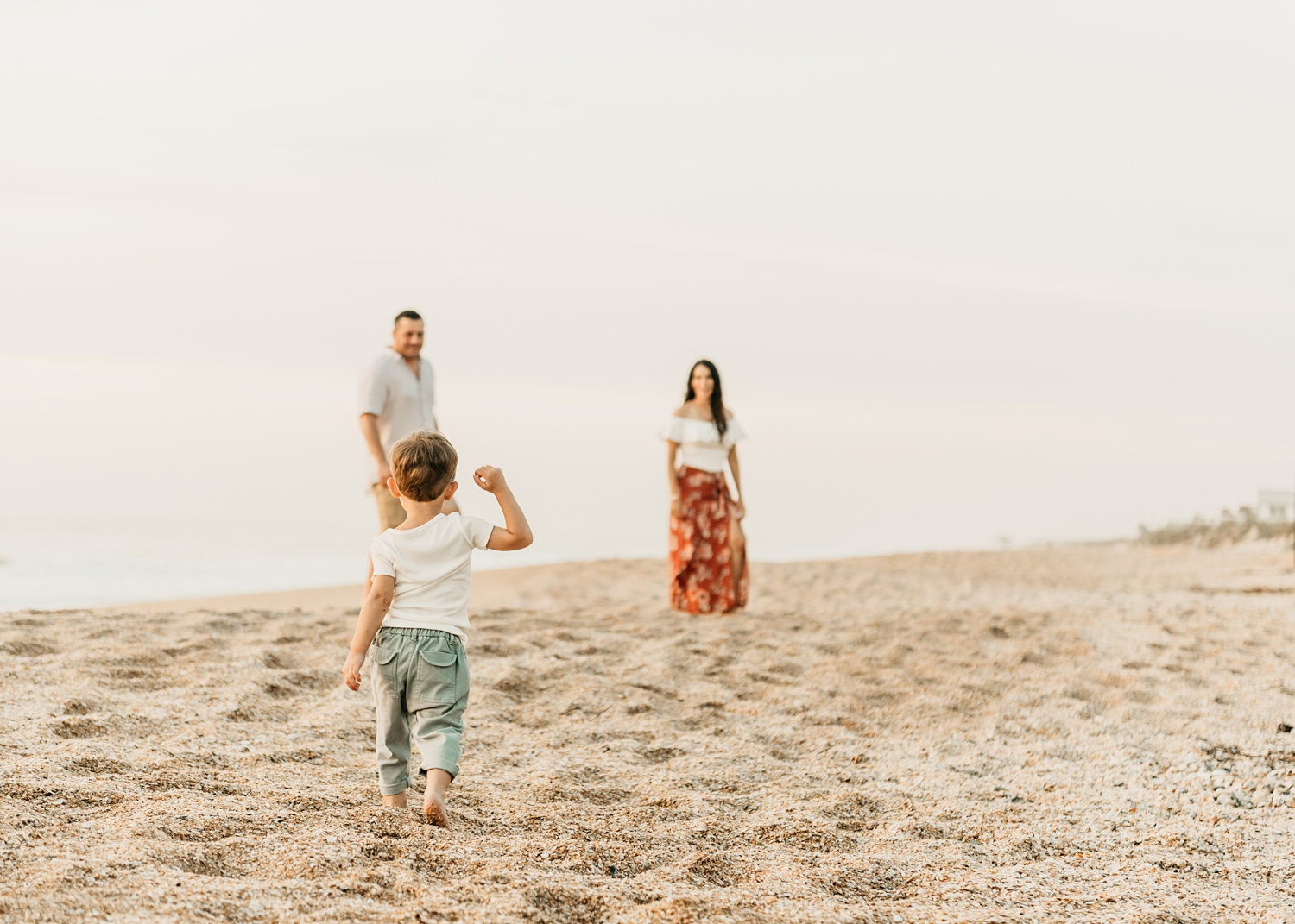 toddler walking toward parents, St. Augustine Beach, Florida, Rya Duncklee Photography