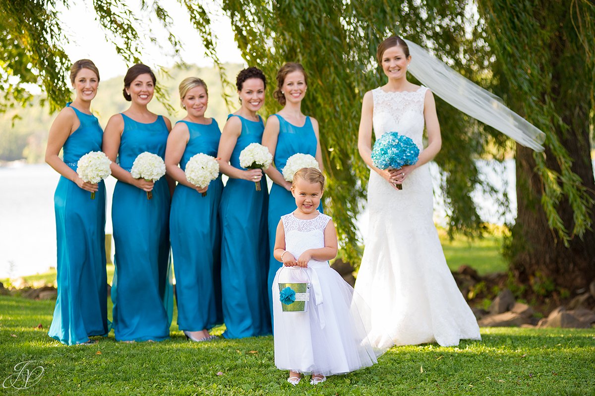 adorable flower girl with bridesmaids