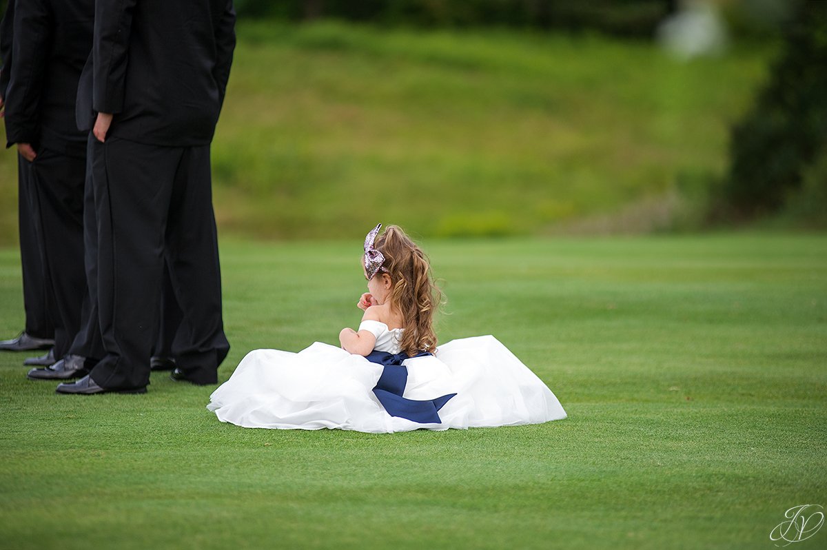 very sweet flower girl next to groomsmen