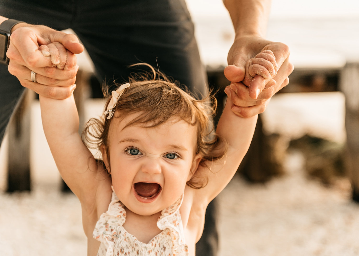 little girl walking holding onto dad's hands, black Apple watch, Rya Duncklee