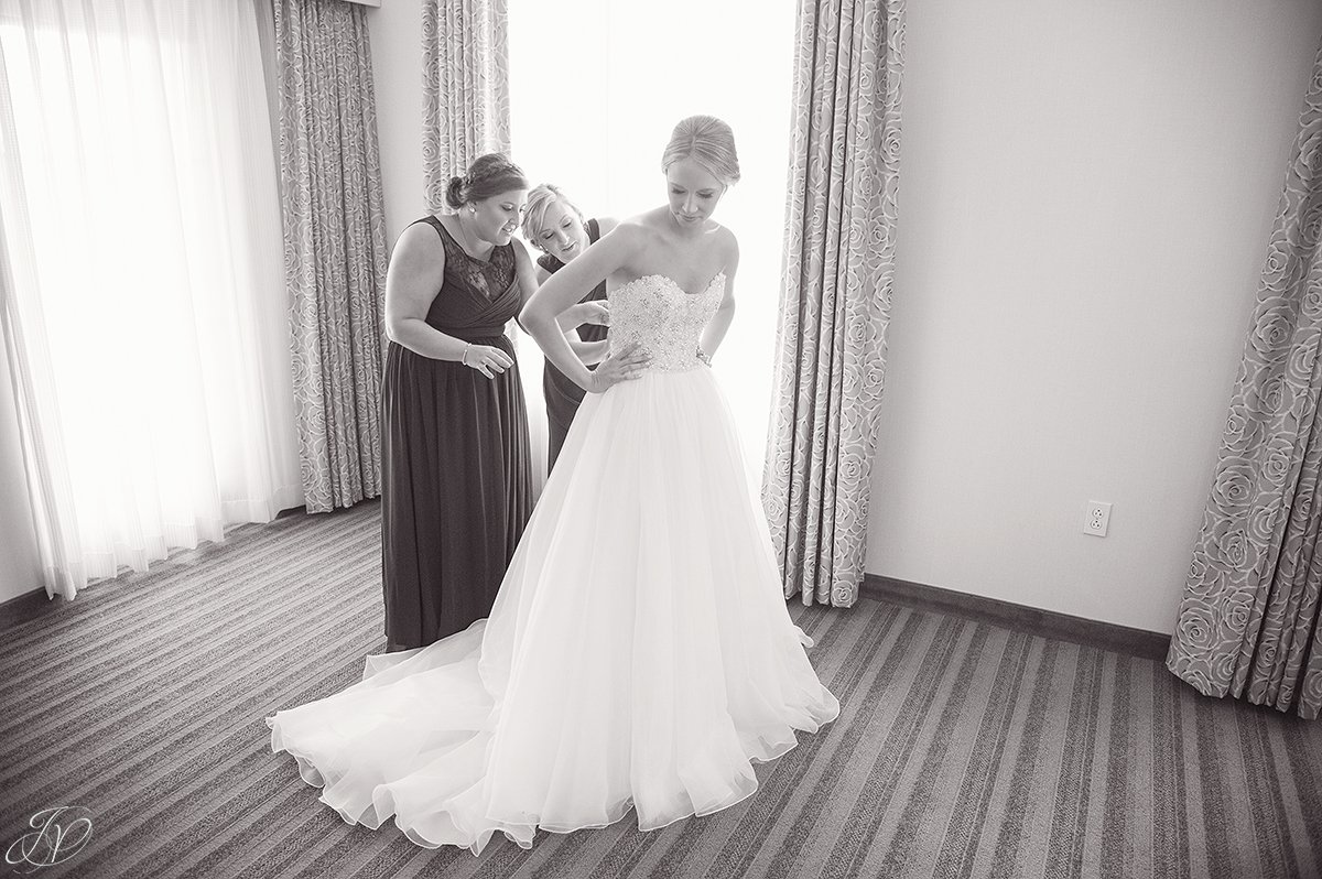 bride getting ready with bridesmaids