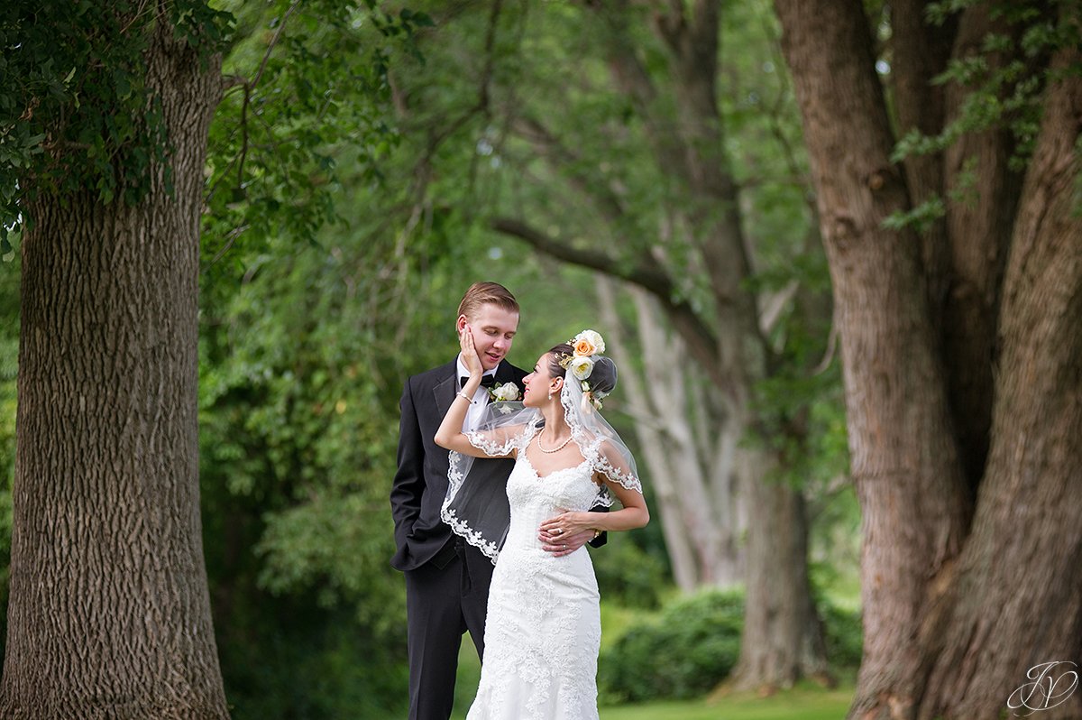bride touching grooms face normanside country club
