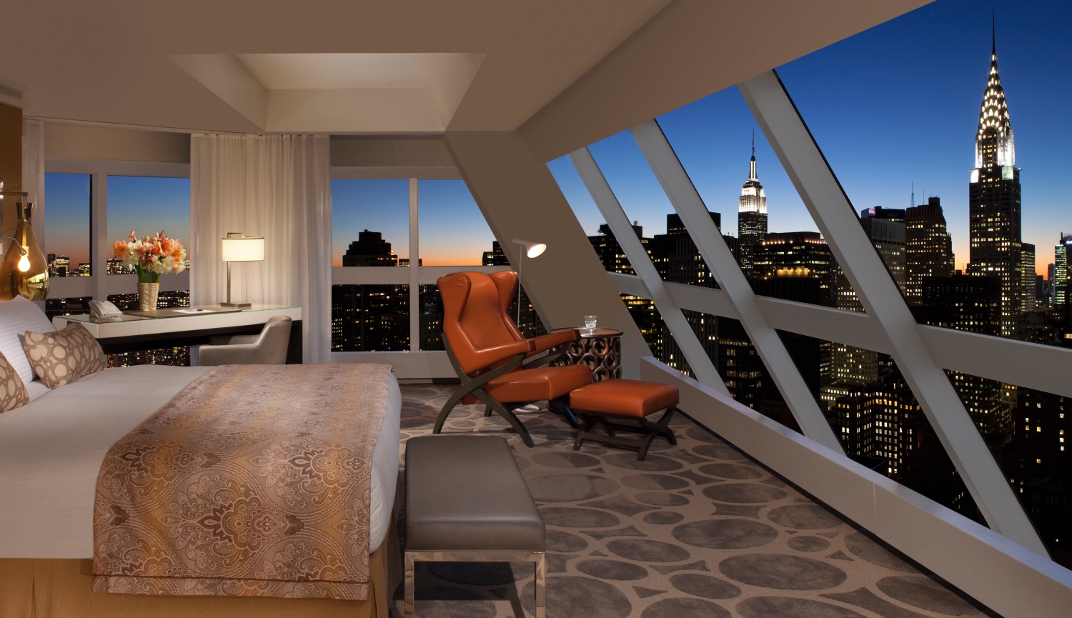 Beautifully decorated Guest room with huge window overlooking the New York City Skyline.