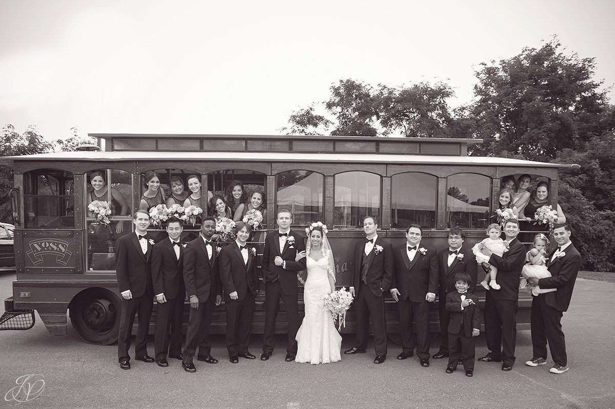 large bridal party in front of trolly normanside country club 