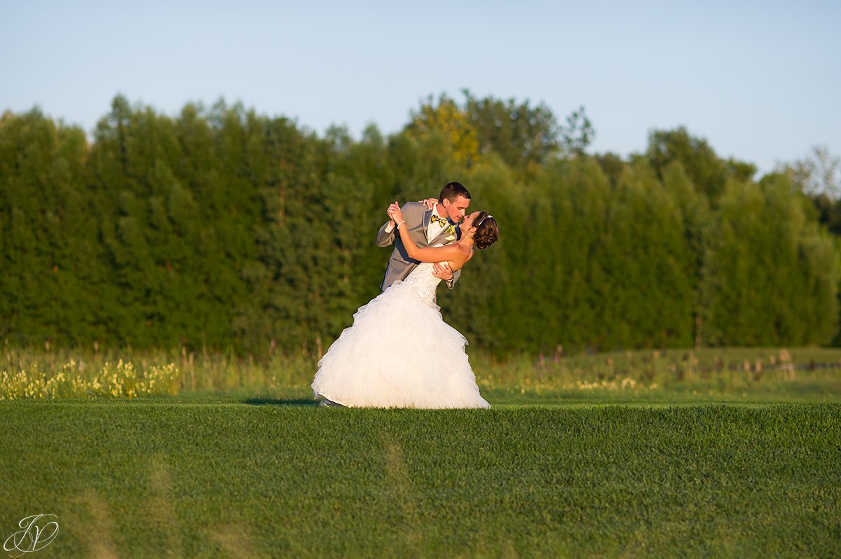 groom dipping bride sunset Arrowhead Golf Club
