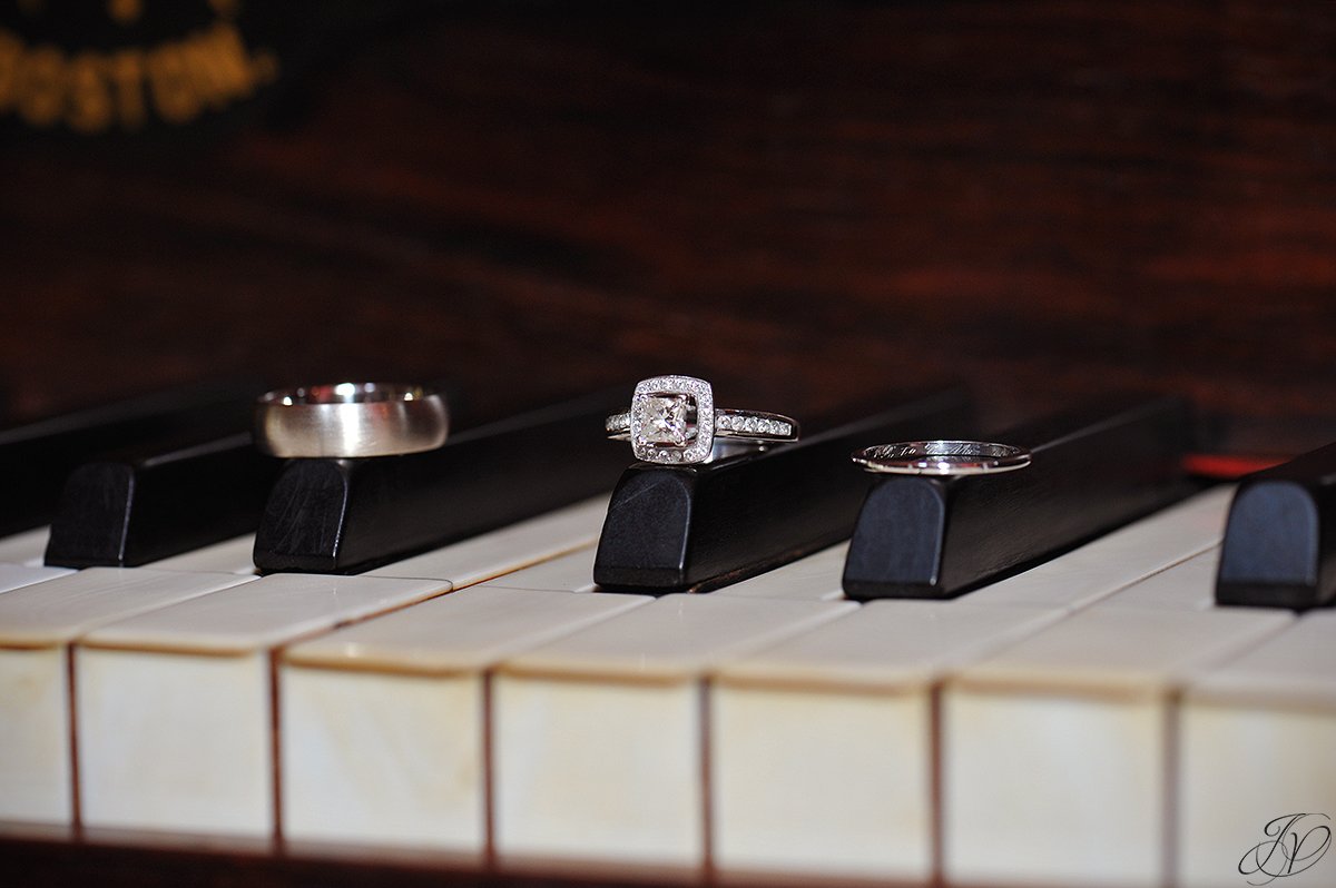 unique wedding rings photo on piano
