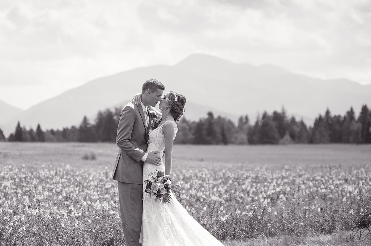 bridal portrait in front of mountain lake placid black and white