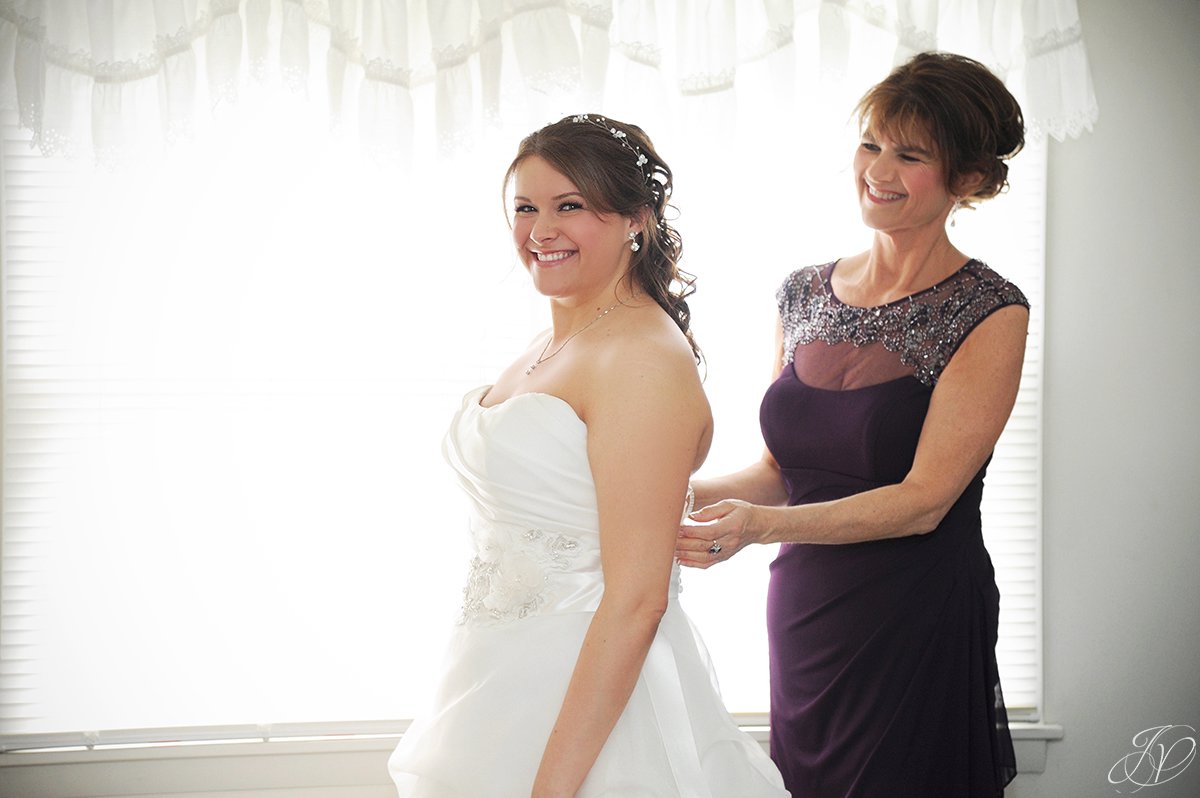 photo of bride getting ready with her mom