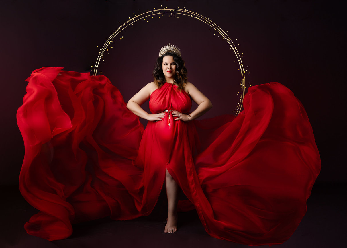 Elegant maternity portrait wearing a red dress, Orlando photographer