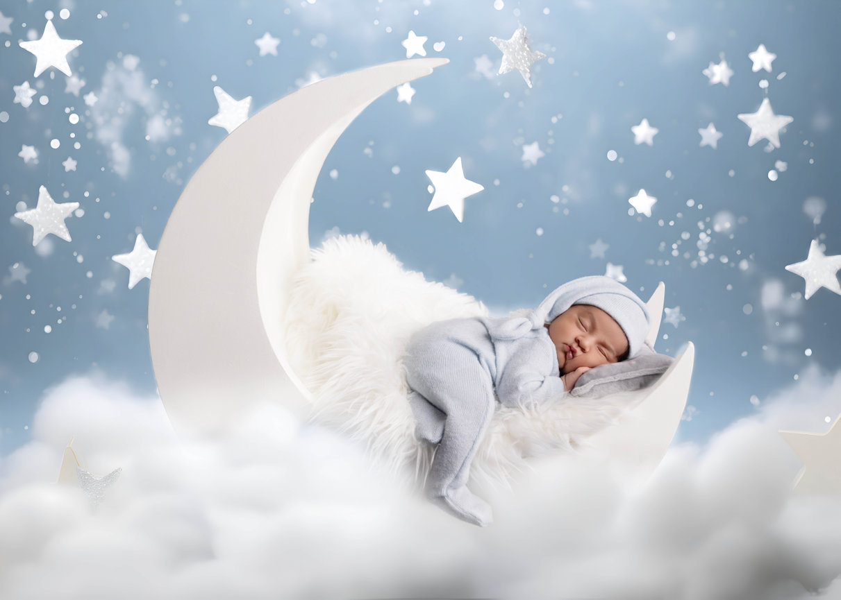 Sleeping newborn baby in a white moon - Orlando newborn photographer