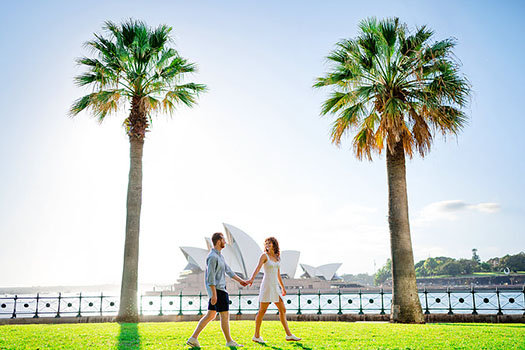 Couple walking in a park during a Sydney Opera House Photoshoot with Sarah Iris Photography.
