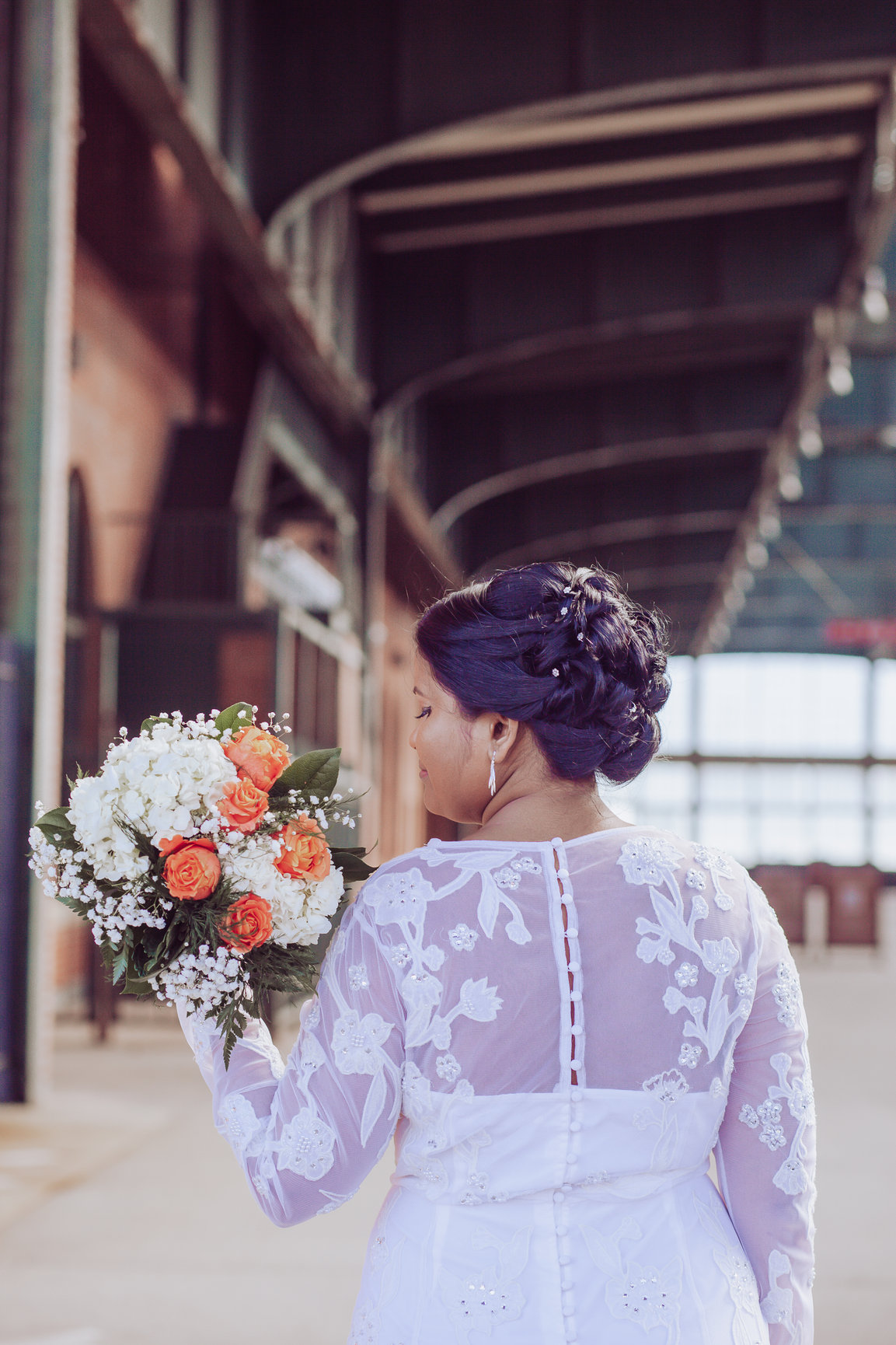 Bride posing with her bridal bouquet in Liberty State Park