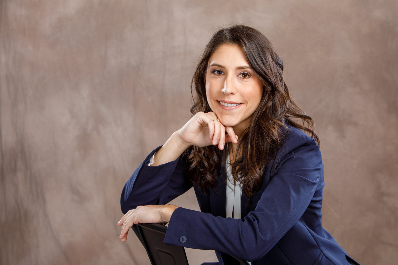 contemporary portrait of a young female attorney in navy suit