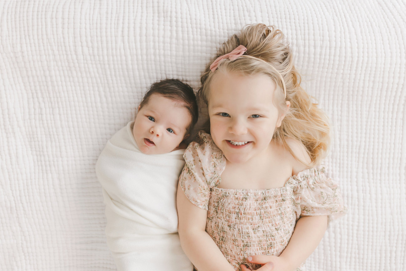 Newborn and sibling photo taken by Minneapolis Newborn Photographer