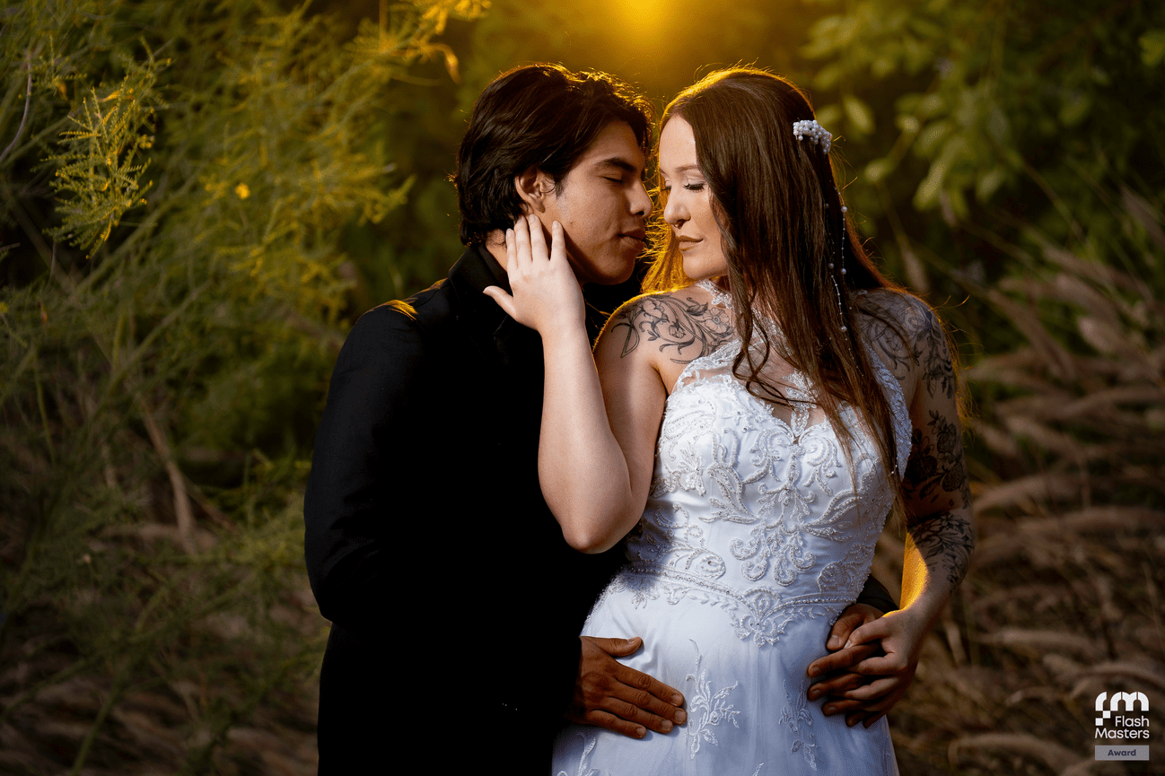 Couple embracing in a romantic sunset setting