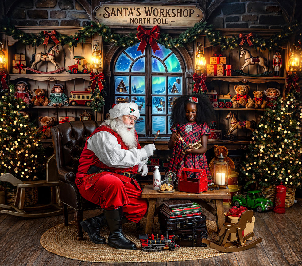 Santa Claus sharing a Christmas moment with a child in a festive Santa’s Workshop set at Elle Lux Studios in Wooster, Ohio