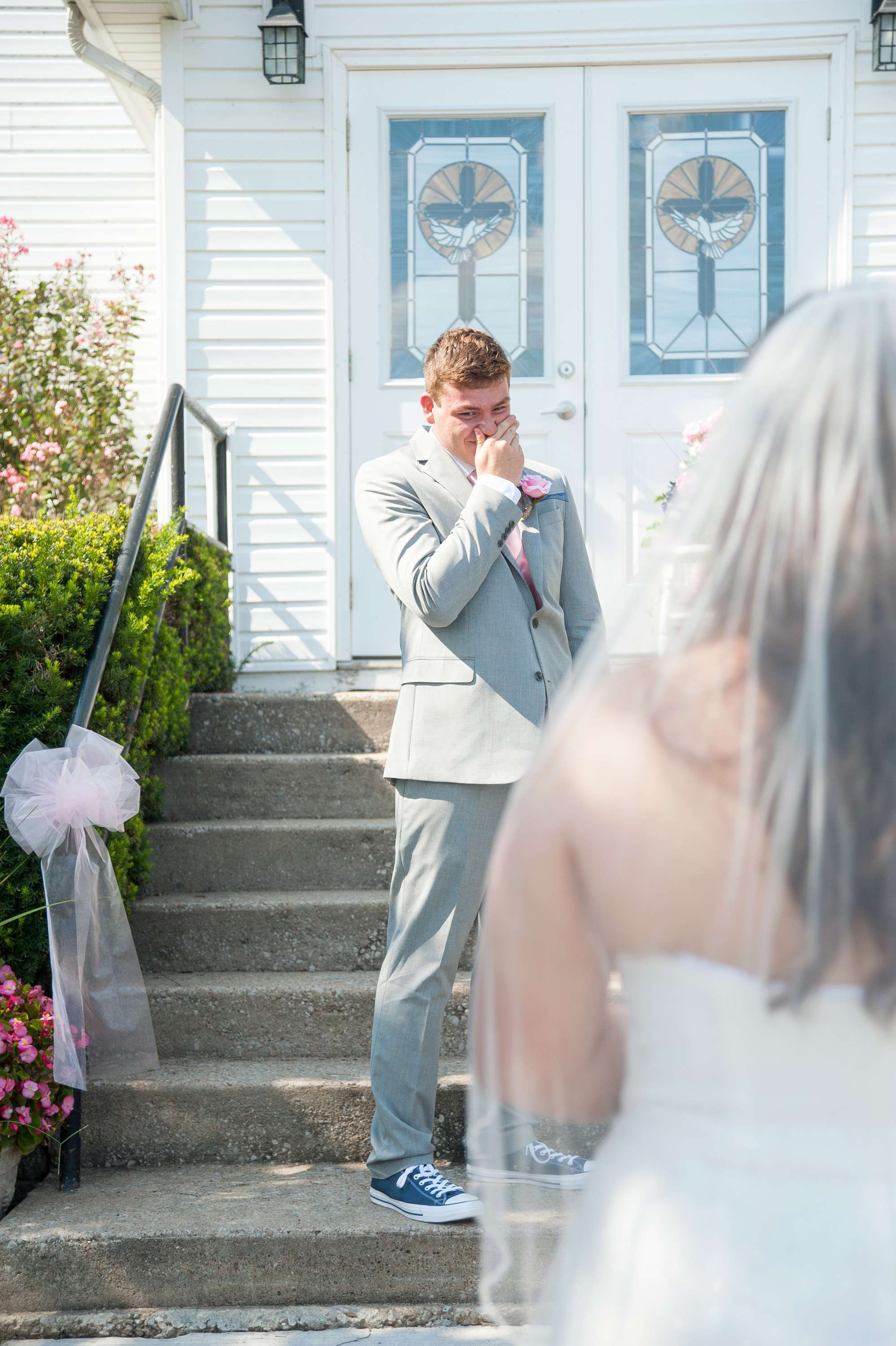 Groom seeing his bride for the first time on their wedding day.