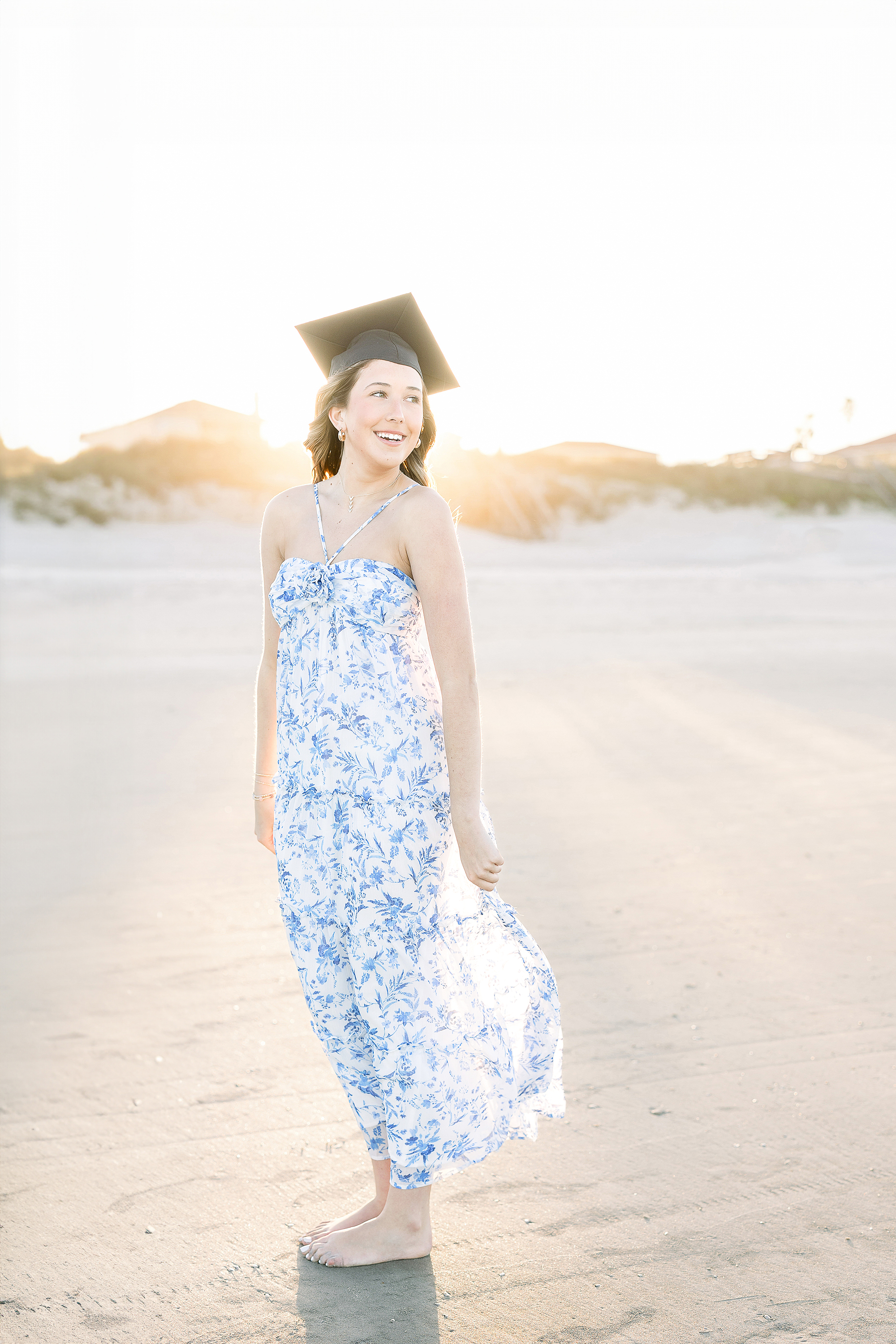 Coastal grad portrait of a young woman on St. Augustine Beach.