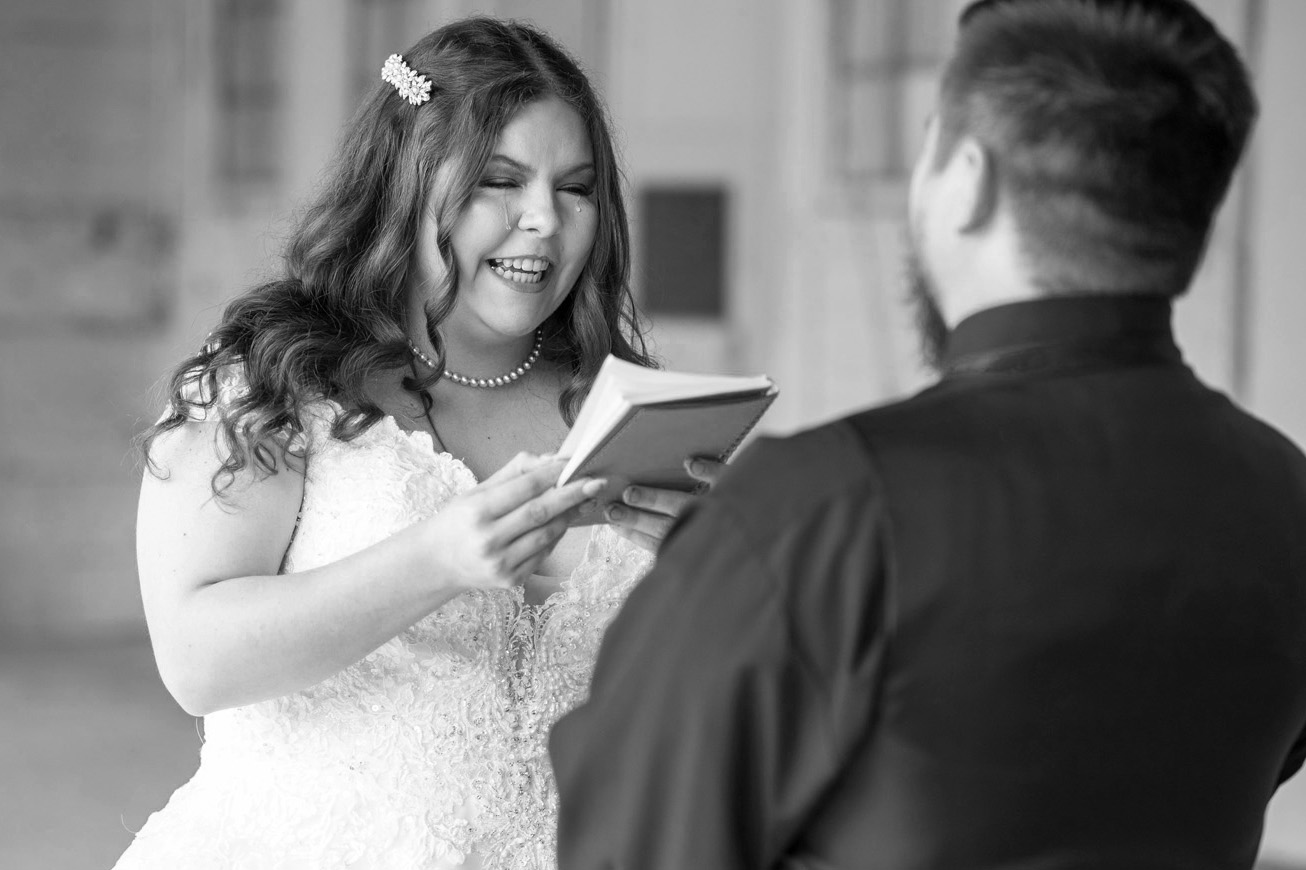 Bride crying happy tears during her first look.