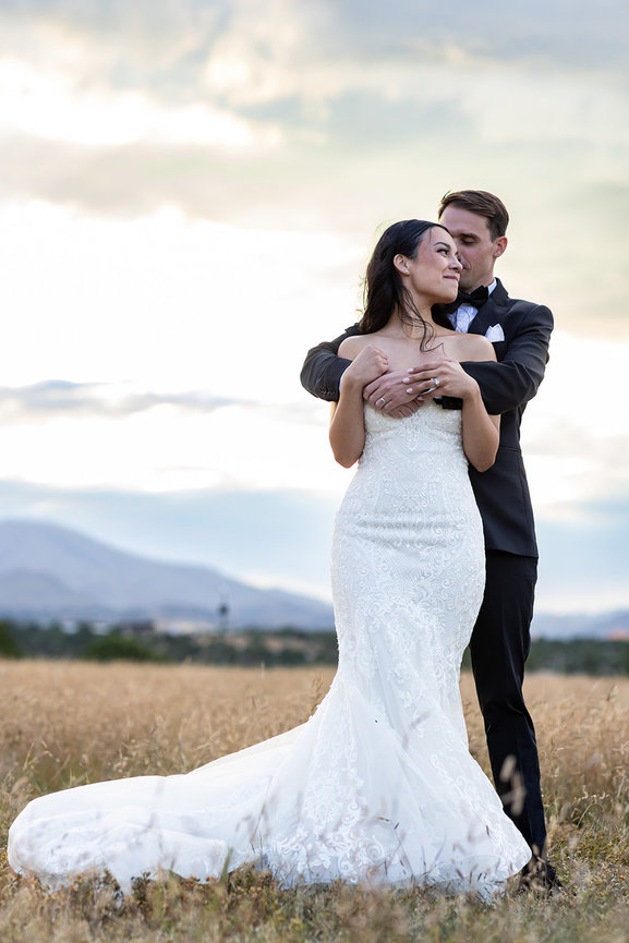 Couple embracing in a field