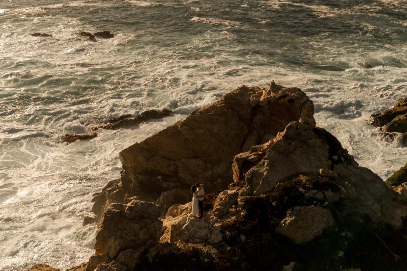 Wide shot of rocks by the sea