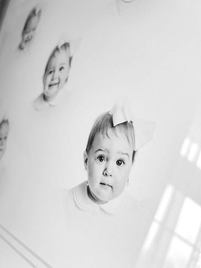 Fine art children’s portrait study in charcoal tones, showcasing five facial expressions in one framed artwork.