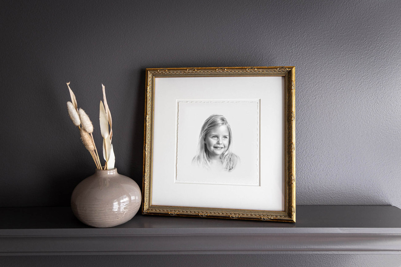 Black and white heirloom portrait of a girl, captured in timeless charcoal style.