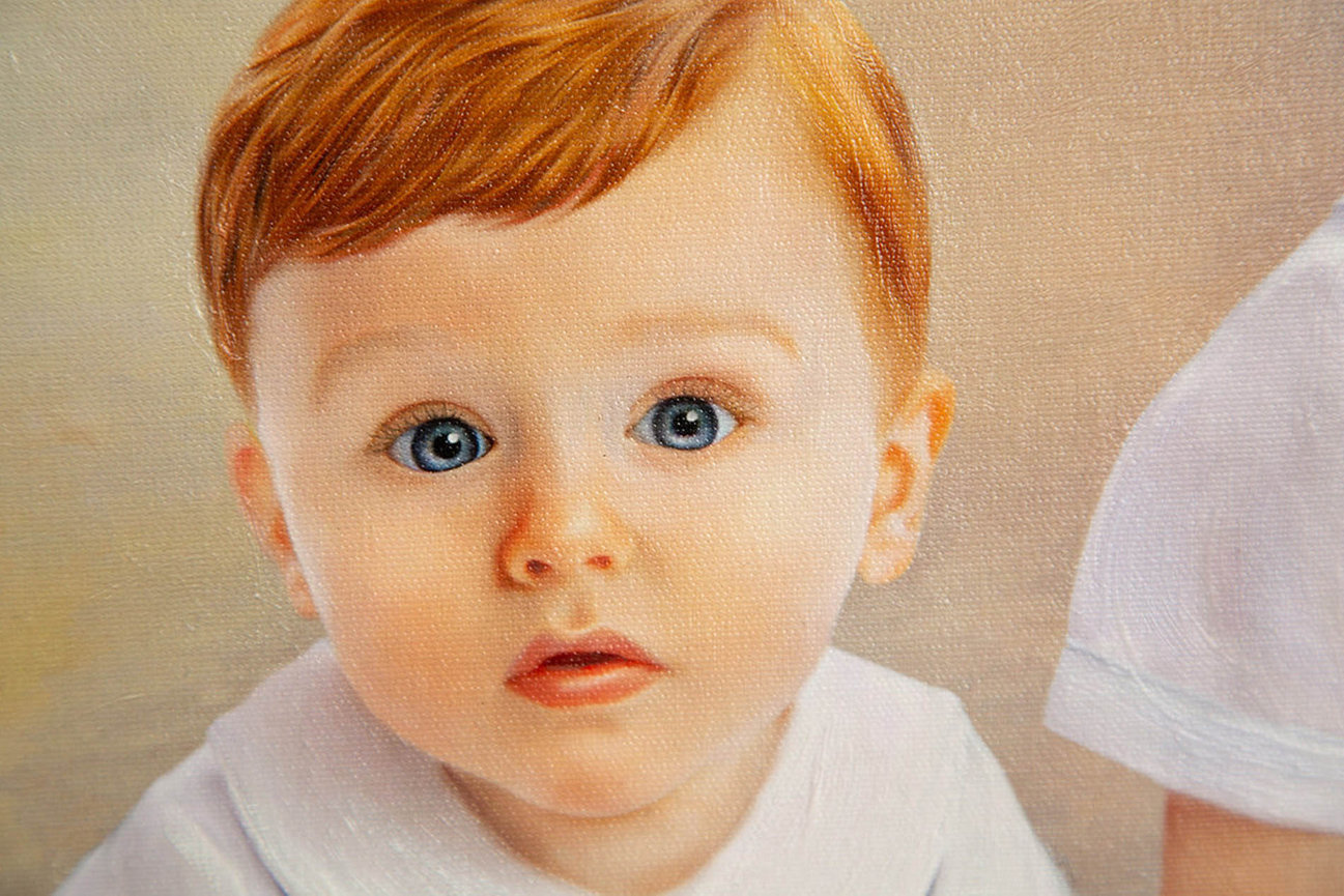 Young baby boy showing up close detail of oil portrait