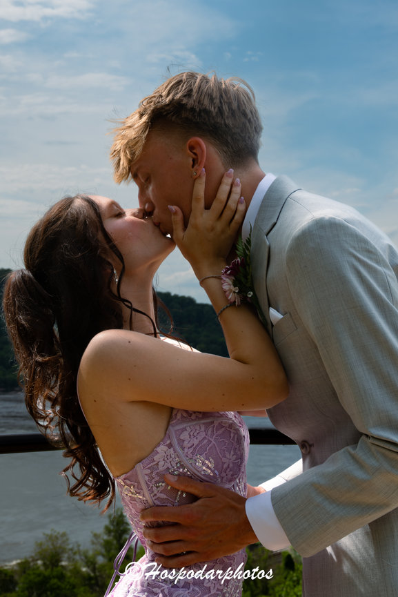 Couple kissing outdoors at a wedding