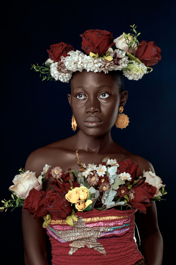 Woman in floral top with flower crown