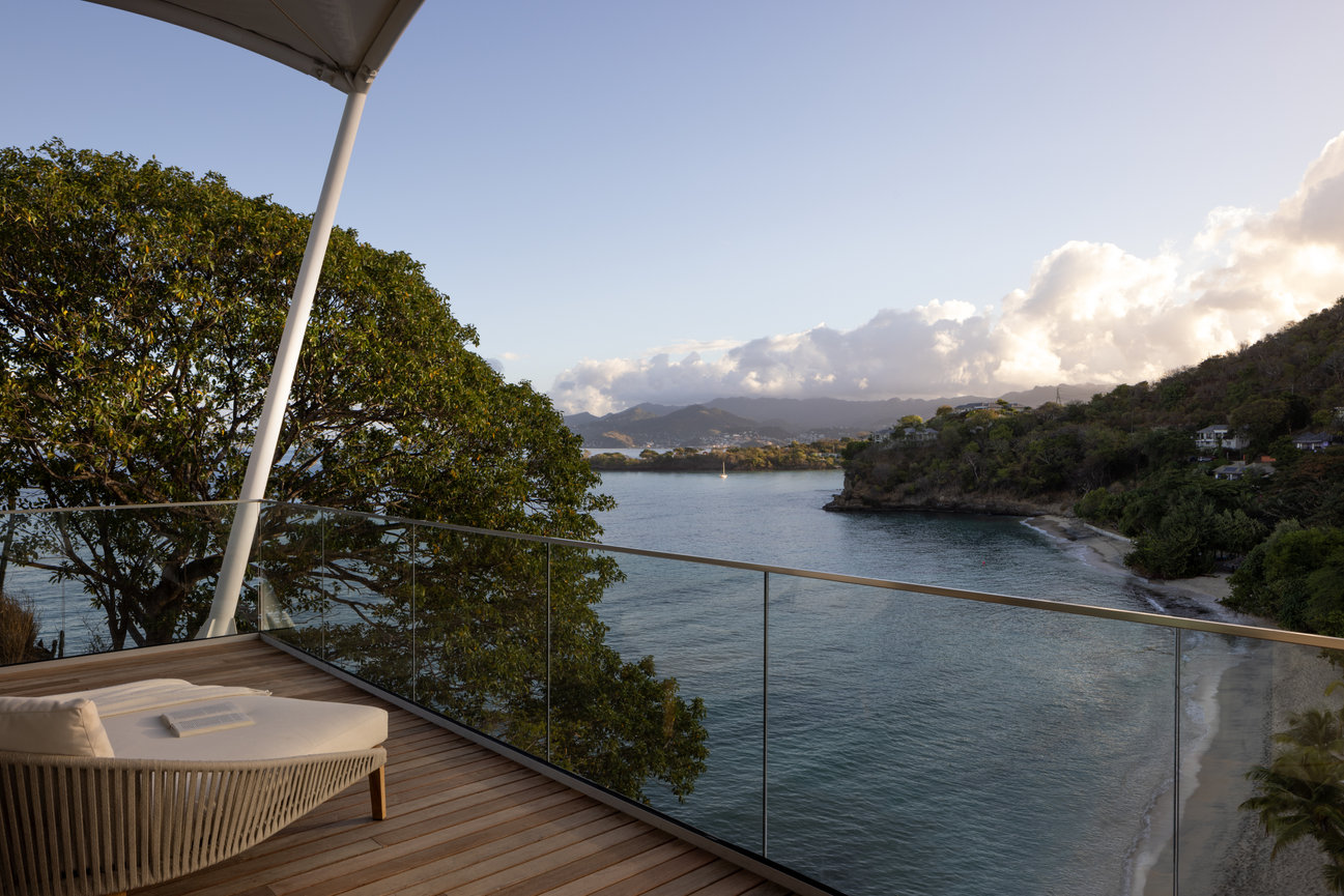 View of Ocean and Mountains off the Guest room Balcony at Silversands Beach House in Grenada.