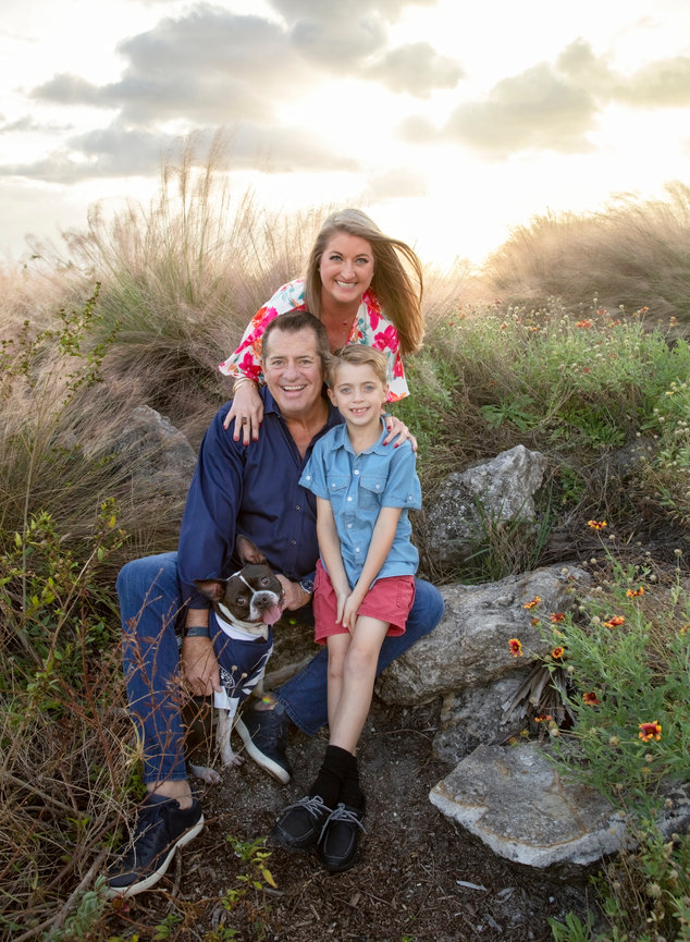 Family at the lake with their dog