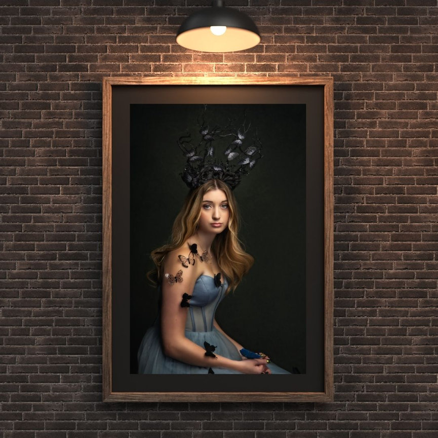 Framed studio portrait with dramatic lighting, highlighting IPS artwork from Braly Studios.