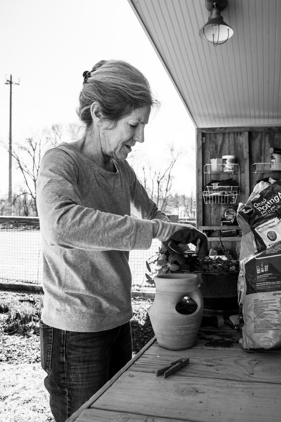 Older white female gardening, black and white lifestyle image, Photography by Heather Raub of FrontRoom Images