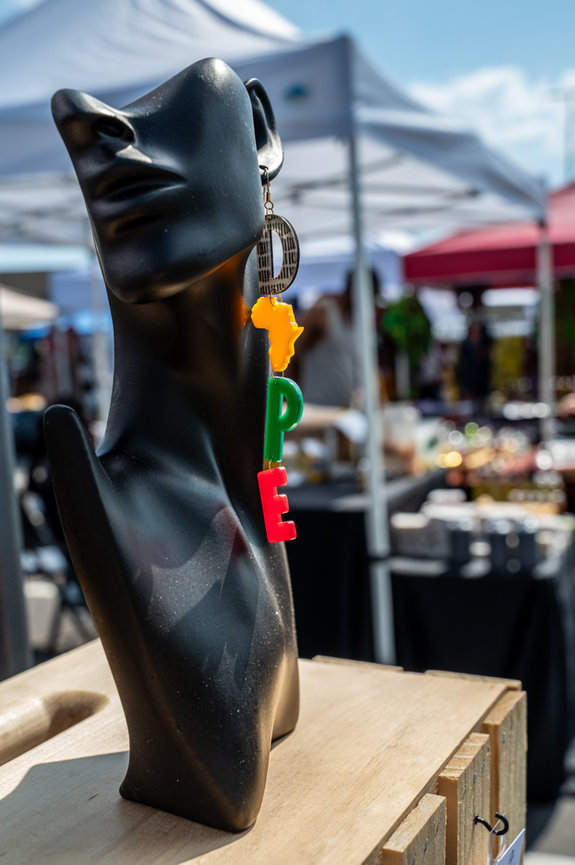 great job capturing the vibe of outdoor community-based charlotte event photography captured a jewelry vendor with dope earrings artistic jo hayes images