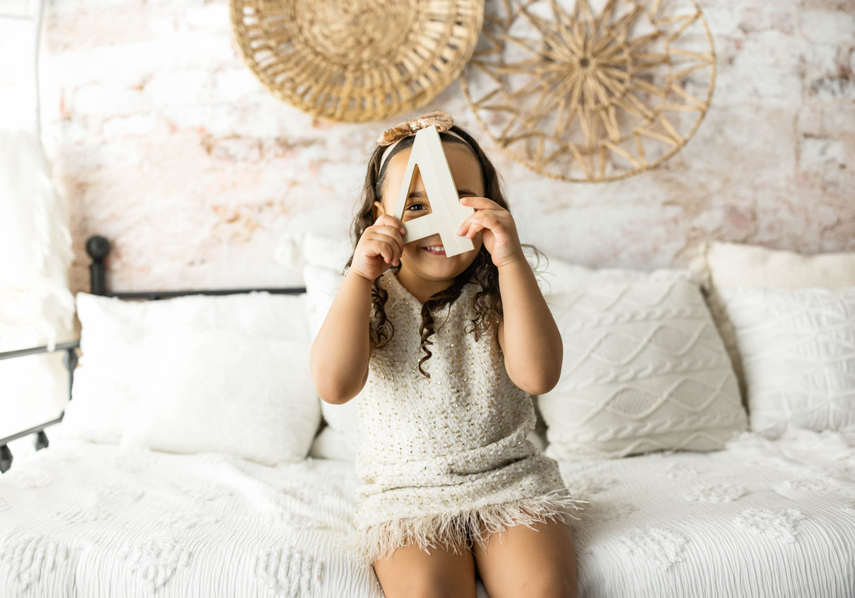 Children, sisters holding hands tulle dresses in heartfelt studio portrait