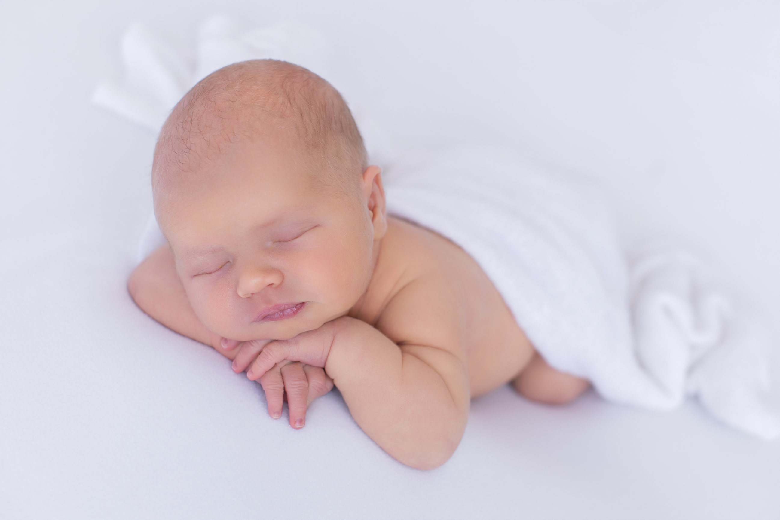 Calgary newborn photography white mauve and big brother love Newborn III session photo 5