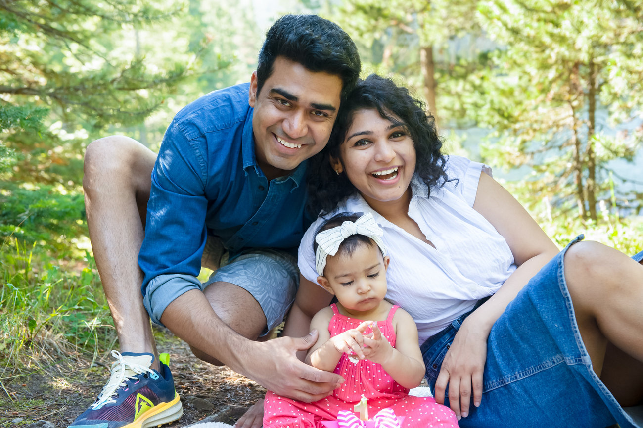 family of three celebrating their daughter's birthday with a photo session in Bozeman, Montana