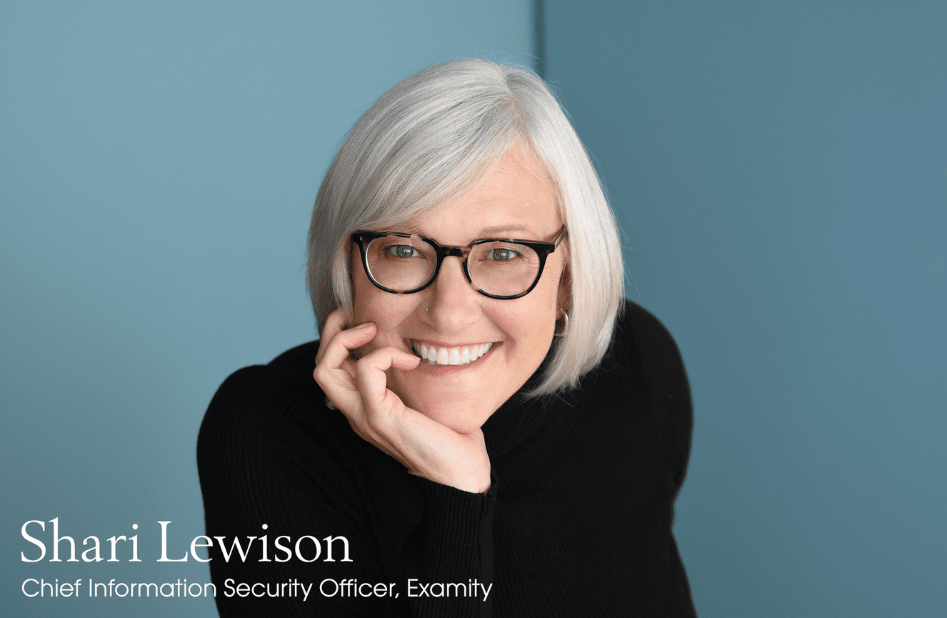 Shari, chief information security officer, rests her chin in her hand and smiles for her business photo session at Kliks Photography.