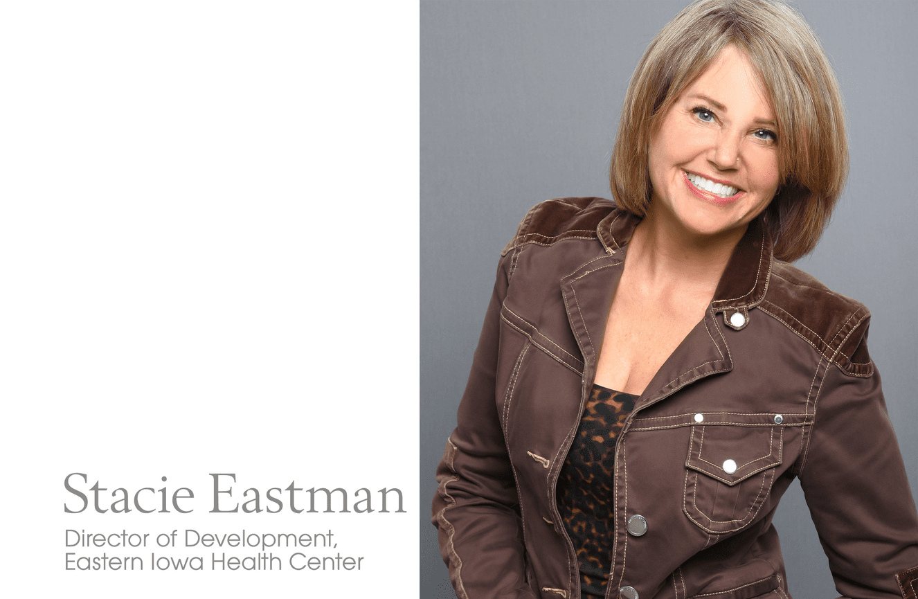 A brightly smiling headshot of Stacie, the director of development at the Eastern Iowa Health Center, wearing a fun brown jean jacket.