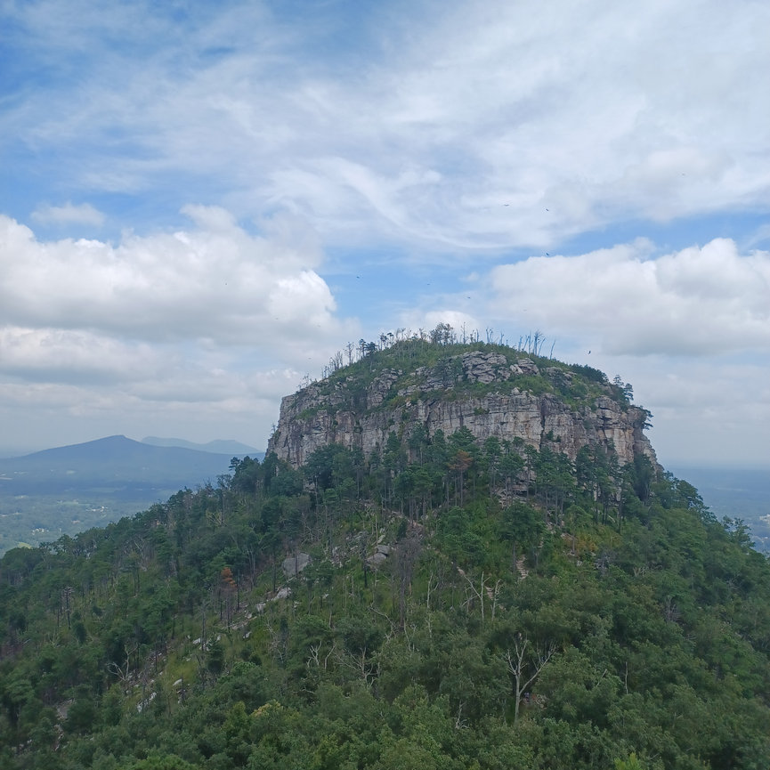 Mountain peak under a cloudy sky