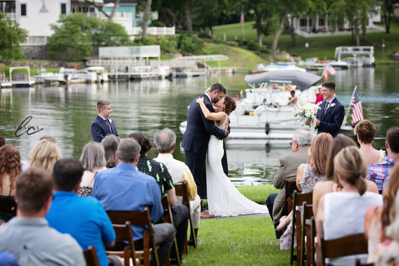Bride and groom exchanging vows during an outdoor wedding ceremony